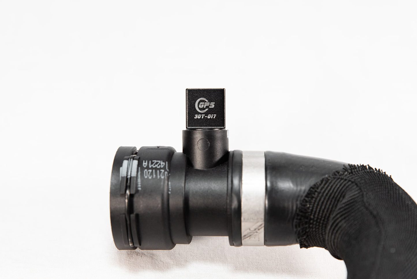 Black anodized CNC-machined 6061 aluminum lower radiator hose drain plug by GPS, featuring etched logo and 3.0T-017 marking – premium upgrade for Audi 3.0T engines.