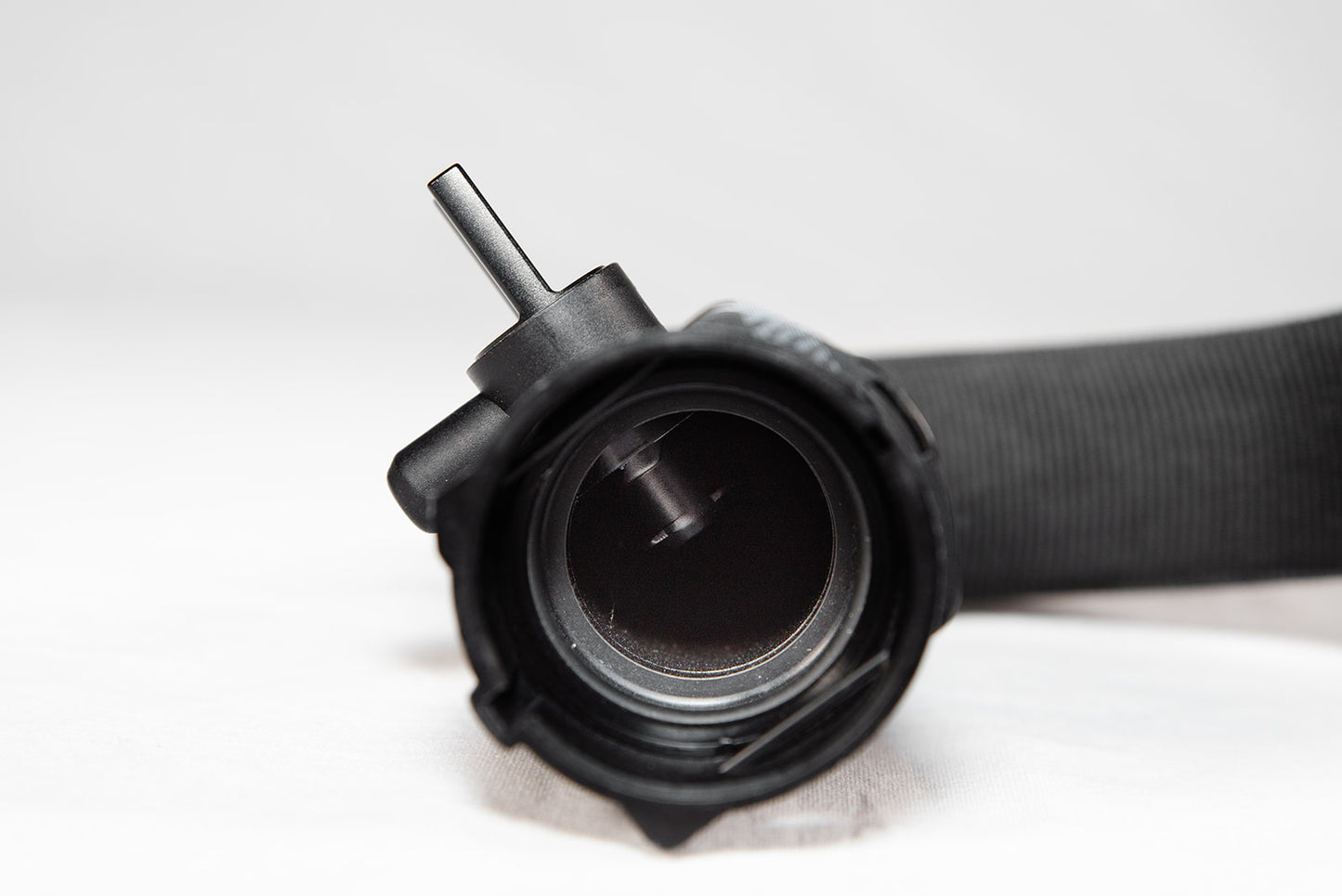 Black anodized CNC-machined 6061 aluminum lower radiator hose drain plug by GPS, featuring etched logo and 3.0T-017 marking – premium upgrade for Audi 3.0T engines.