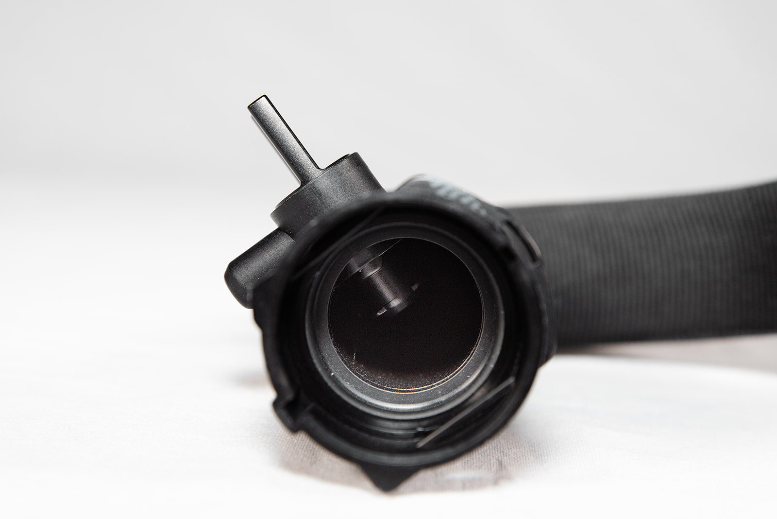 Black anodized CNC-machined 6061 aluminum lower radiator hose drain plug by GPS, featuring etched logo and 3.0T-017 marking – premium upgrade for Audi 3.0T engines.