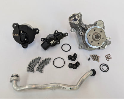 A water pump kit laid out on a white background, including a silver water pump, black pulley and thermostat housings by German performance solutions, an aluminum radiator hose, gaskets, O-rings, and mounting hardware.